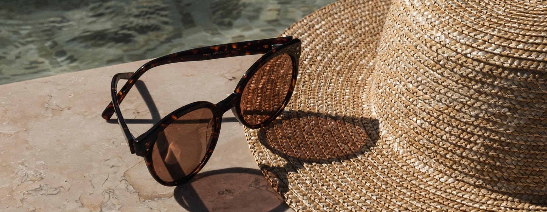 a pair of sunglasses on a beach