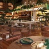 luxurious bar with seating plants and tables