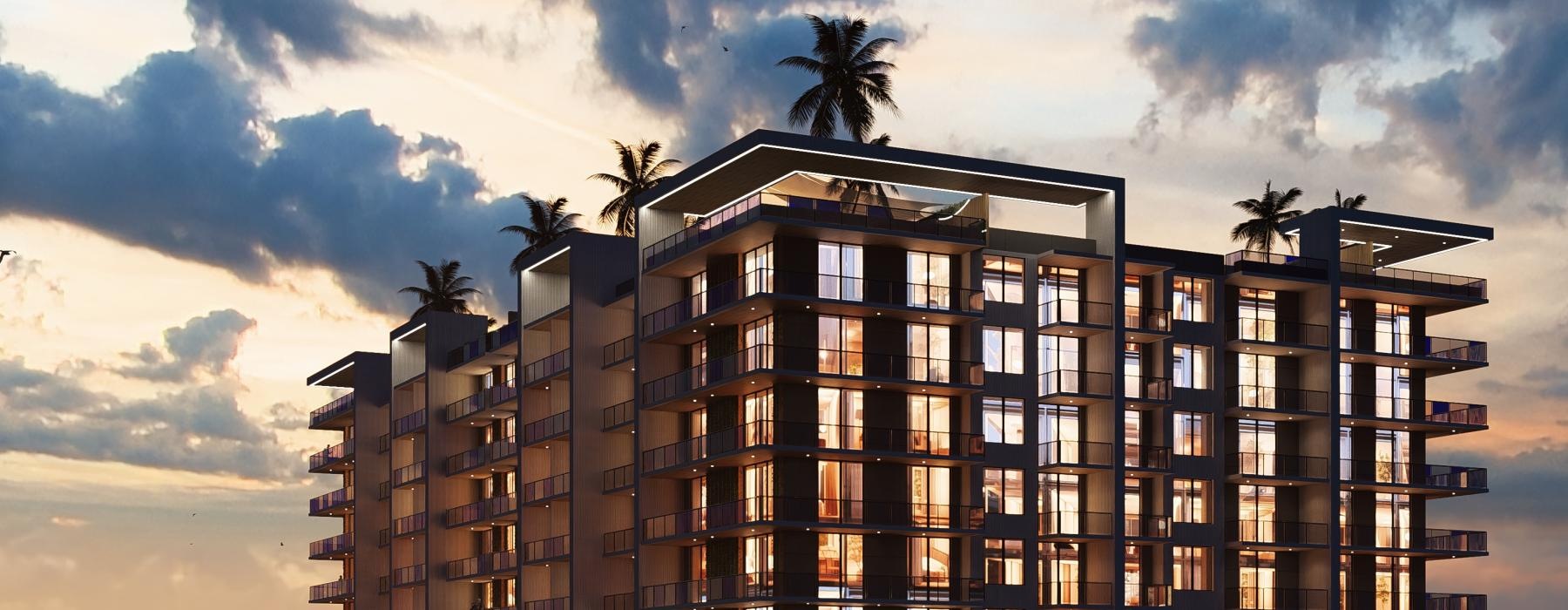 a tall building with palm trees