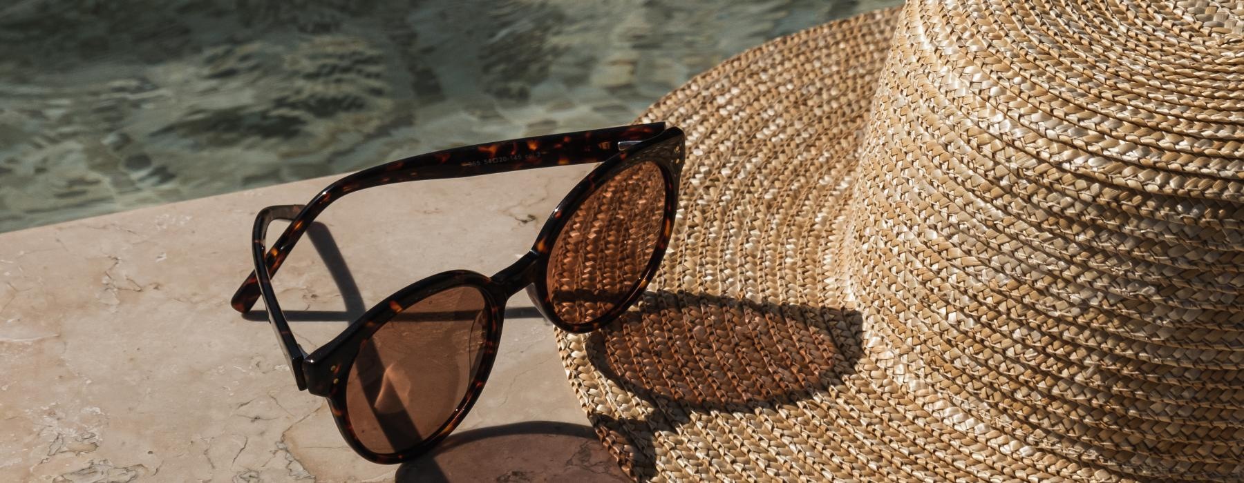 a pair of sunglasses on a beach