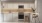 a kitchen with white cabinets